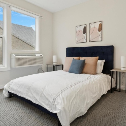 a modern bedroom with good lighting